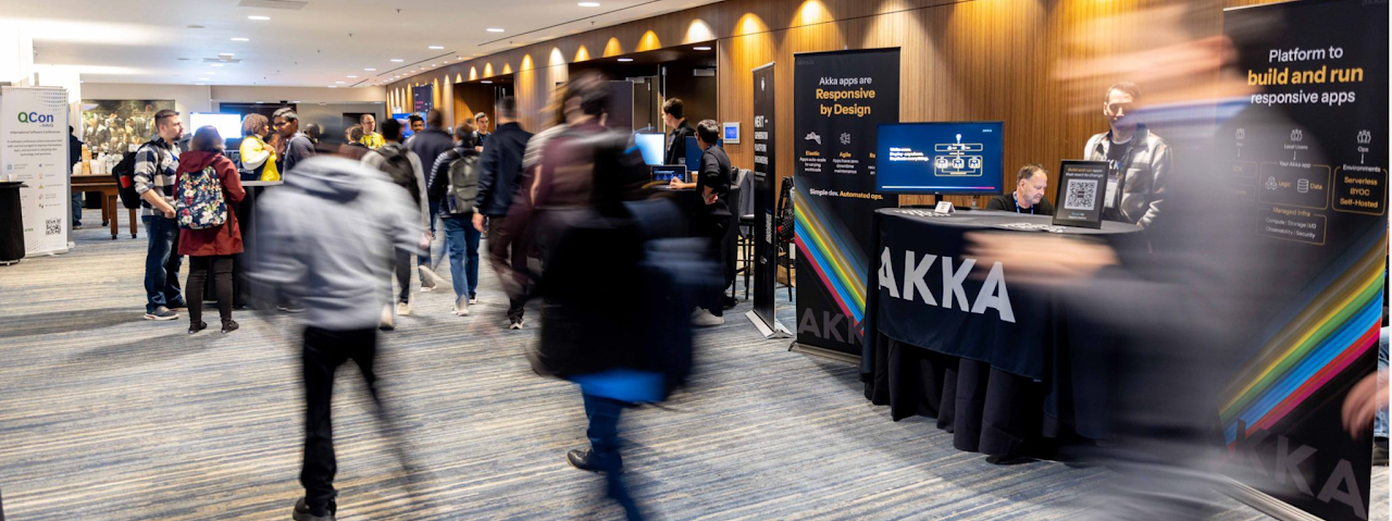QCon sponsor booths on the conference floor